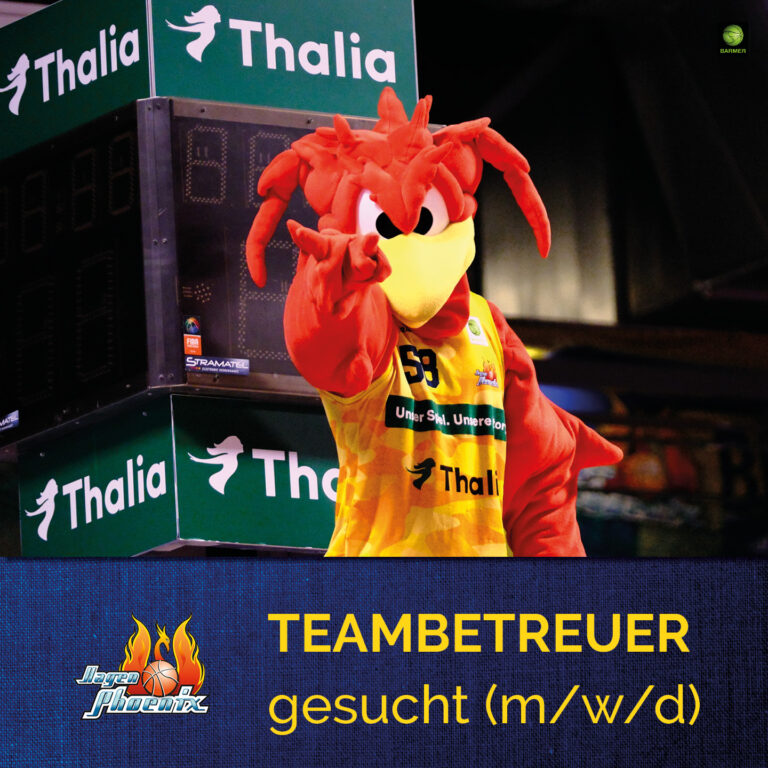 Das orangefarbene Maskottchen mit gelbem Trikot zeigt lachend auf die Kamera