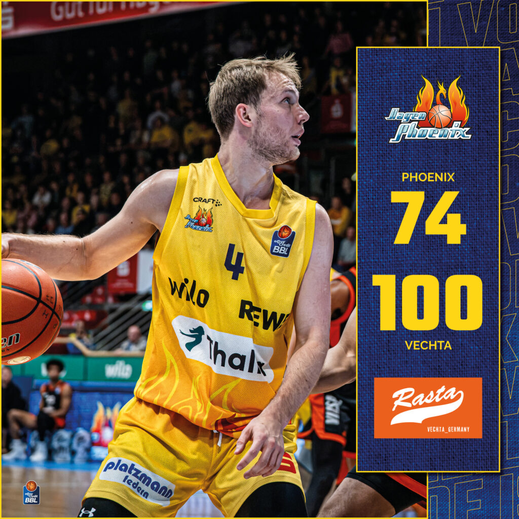 Konzentrierter Basketballspieler im gelben Phoenix Hagen Trikot mit Ball